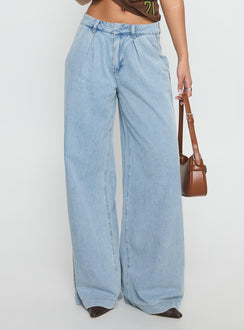 side view of model wearing Princess Polly Siloh Wide Leg Denim Jeans Blue Mid Rise Jeans 