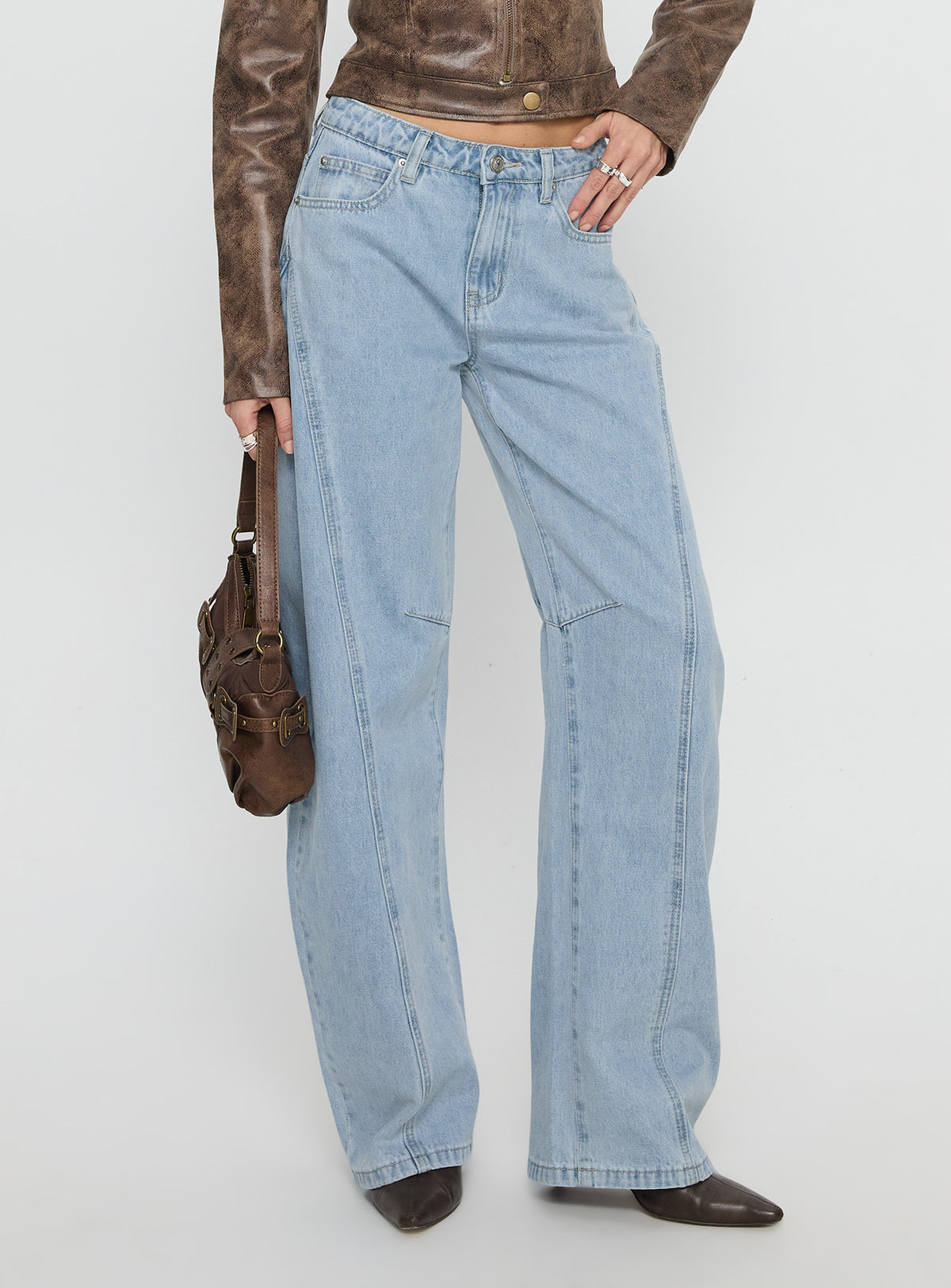 side view of model wearing Princess Polly Lost Track Mid Rise Barrel Leg Jeans Ice Wash Mid Rise Jeans 