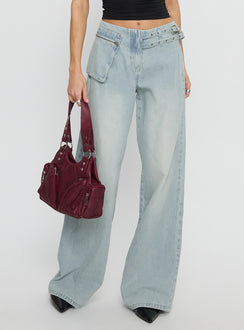 back view of model wearing Princess Polly Paltrow Mid Rise Wide Leg Cargo Jeans Faded Blue Wash Mid Rise Jeans 