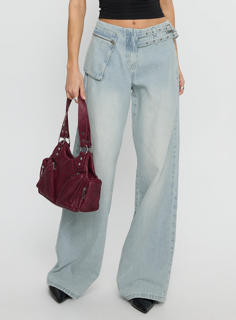 back view of model wearing Princess Polly Paltrow Mid Rise Wide Leg Cargo Jeans Faded Blue Wash Mid Rise Jeans 