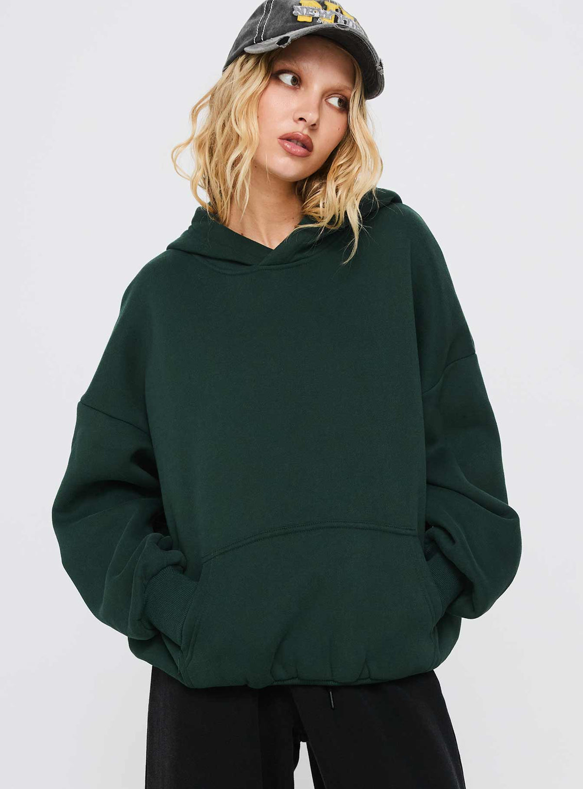 front view of model wearing Princess Polly Good Luck Graphic Hoodie Green / Blue Longline Jumpers Jumpers 