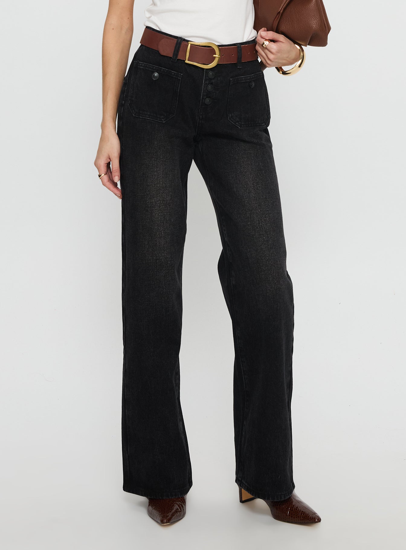 side view of model wearing Princess Polly Carianne Low Rise Wide Leg Jeans Washed Black Mid Rise Jeans 