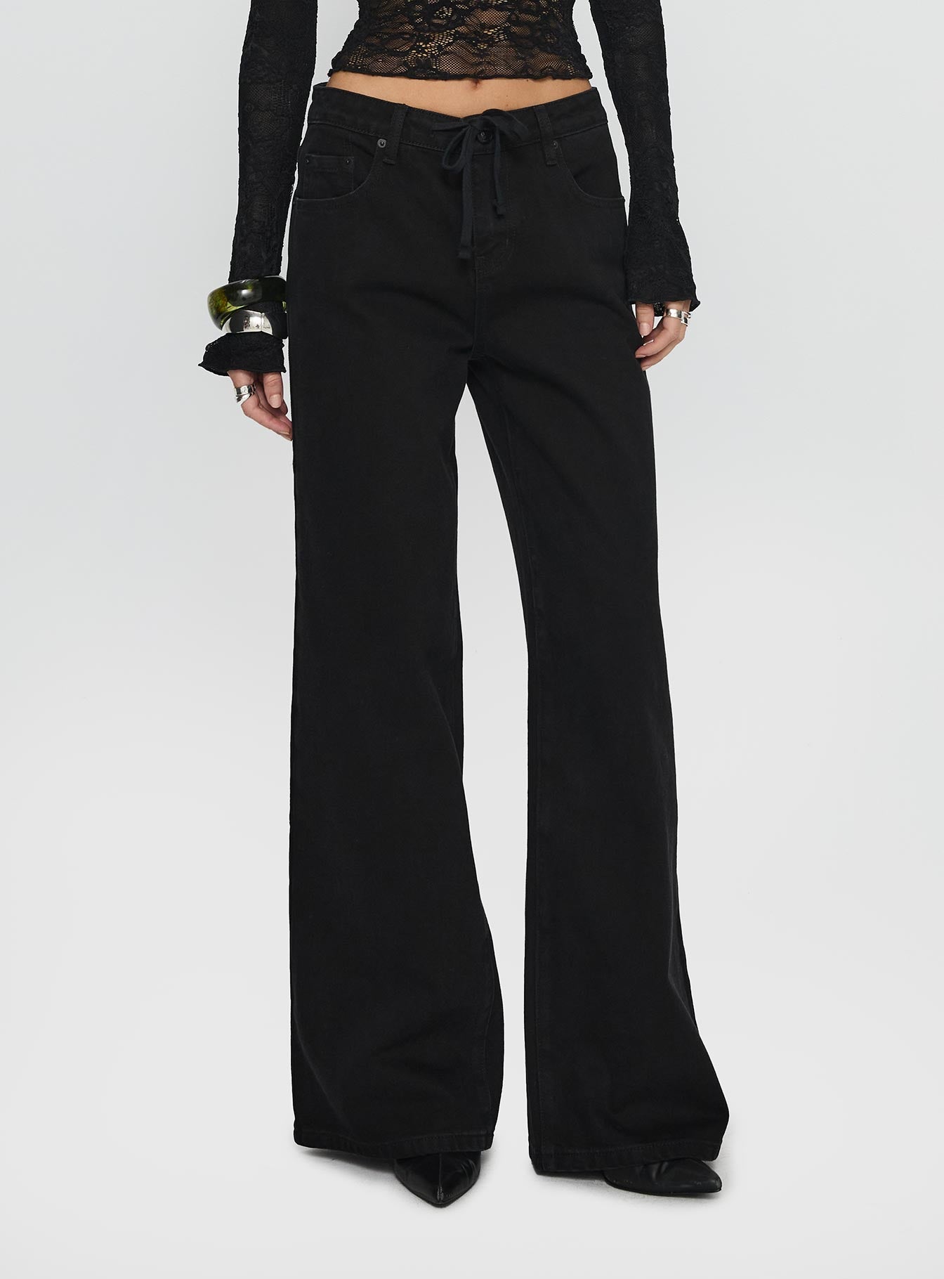 side view of model wearing Princess Polly Mellowed Out Low Rise Straight Leg Jeans Washed Black Low Rise Jeans 