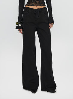 side view of model wearing Princess Polly Mellowed Out Low Rise Straight Leg Jeans Washed Black Low Rise Jeans 