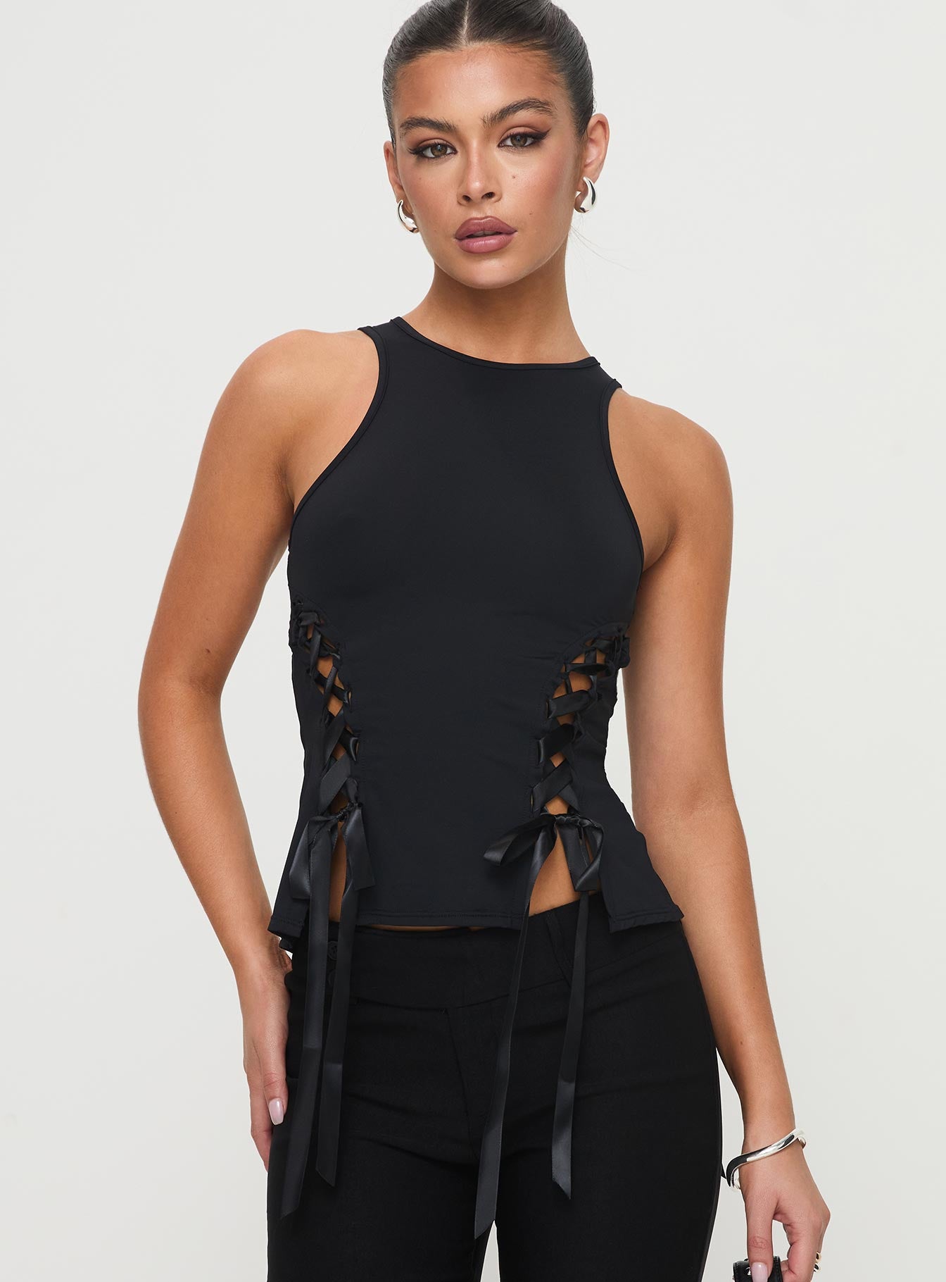 front view of model wearing Princess Polly Bisous Top Black Sleeveless Crew Neck 