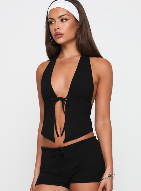 side view of model wearing Princess Polly Obviously Halter Top Black Sleeveless Plunger 