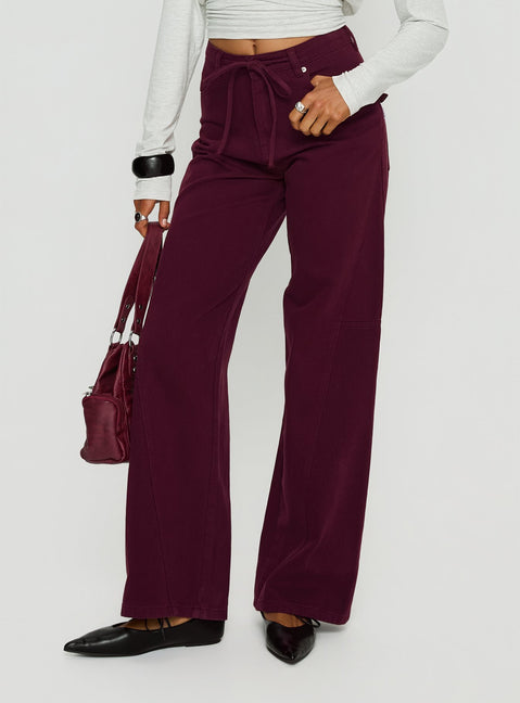 front view of model wearing Princess Polly Bruiser Tie Waist Mid Rise Wide Leg Jeans Currant High Rise Jeans 