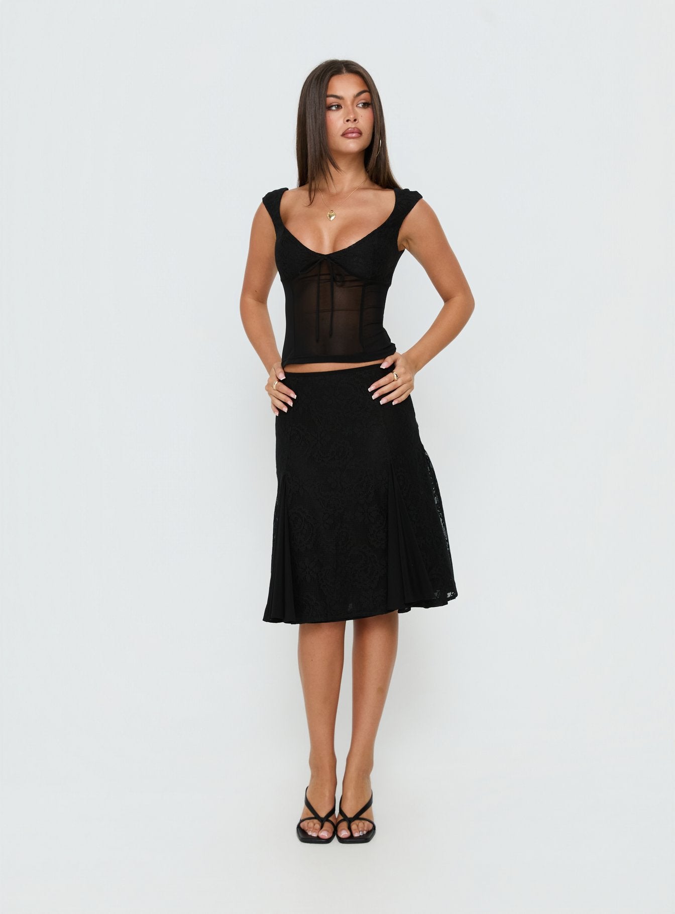 Showcasing the Quani Lace Midi Skirt Black womens-skirts in midi length front view of model wearing Princess Polly