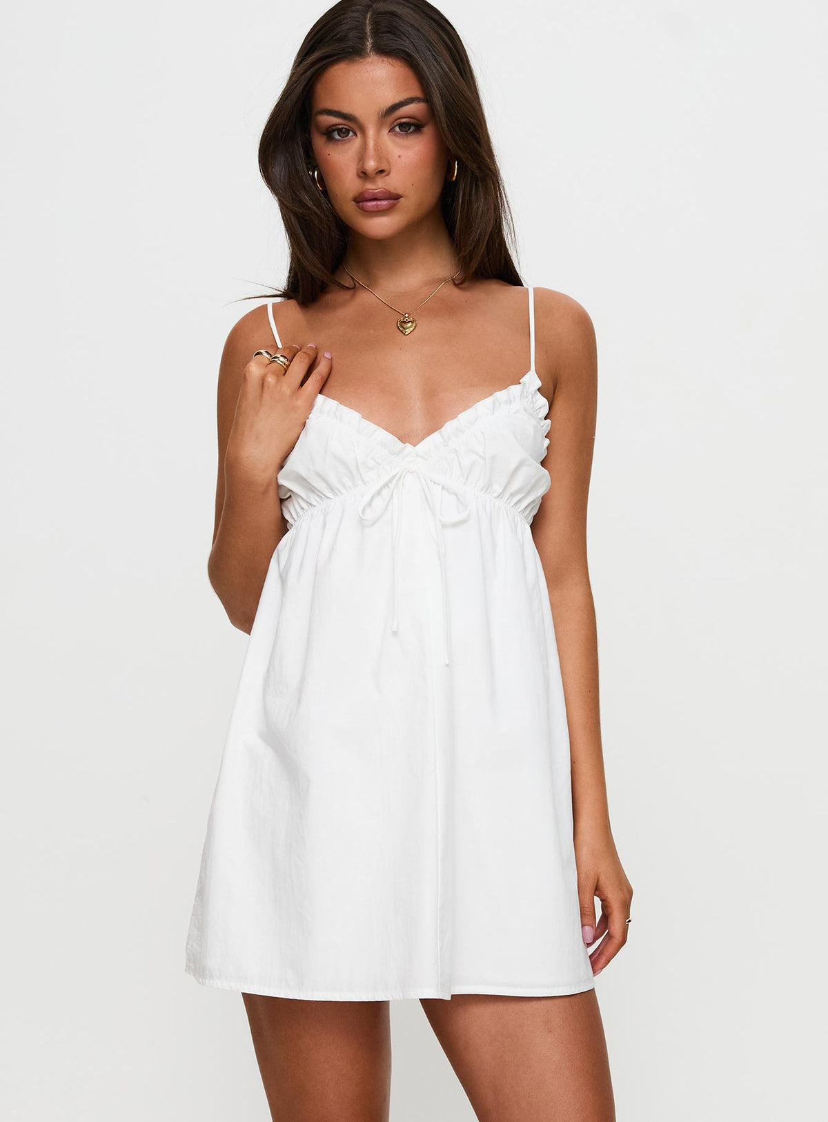 side view of model wearing Princess Polly Alchemy Mini Dress White V-Neck 