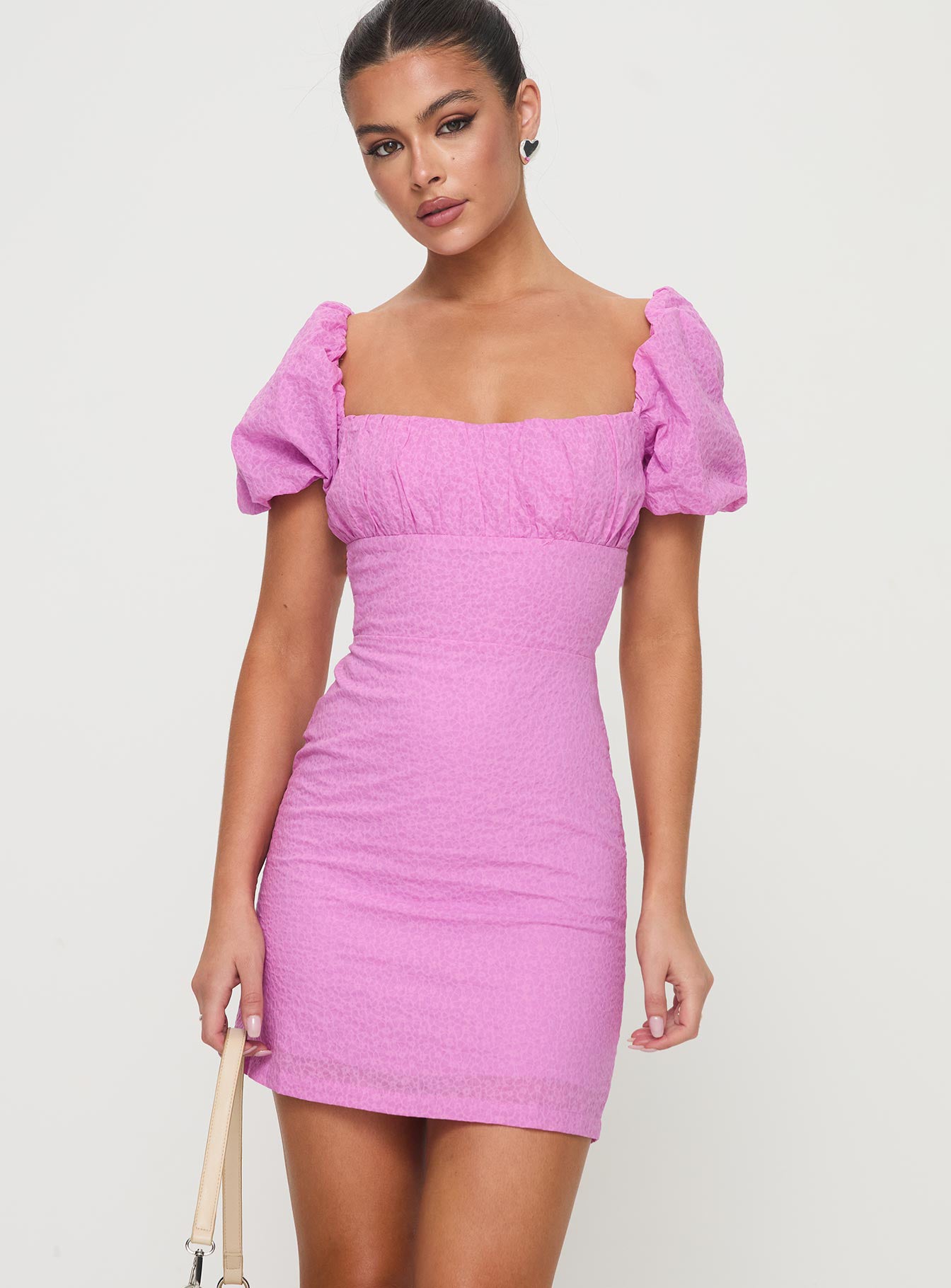 side view of model wearing Princess Polly Tanami Mini Dress Pink Square Neck 