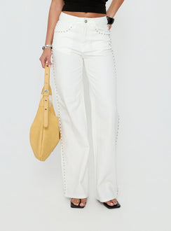 Featuring the Saving Up Mid Rise Straight Leg Studded Jeans White in womens-jeans with silver studded details front view of model wearing Princess Polly