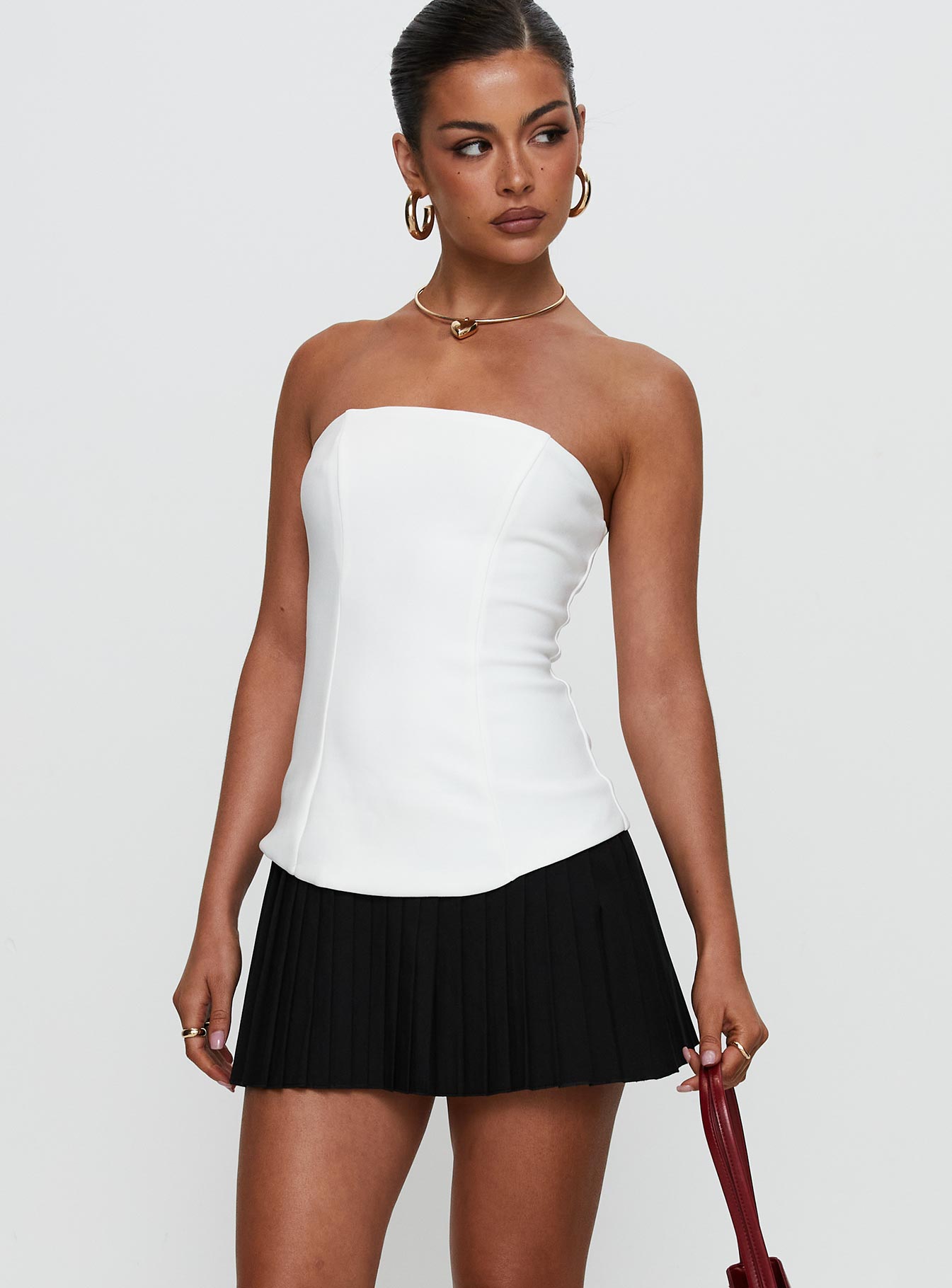side view of model wearing Princess Polly Obsessed Strapless Mini Dress White Straight Neck 
