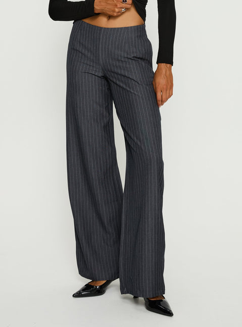 back view of model wearing Princess Polly Khane Low Rise Wide Leg Pant Charcoal Pinstripe Mid Rise Pants 