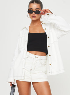 front view of model wearing Princess Polly Katlynne Denim Mini Skort White mid-rise 