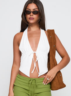 front view of model wearing Princess Polly Obviously Halter Top White Sleeveless Plunger 
