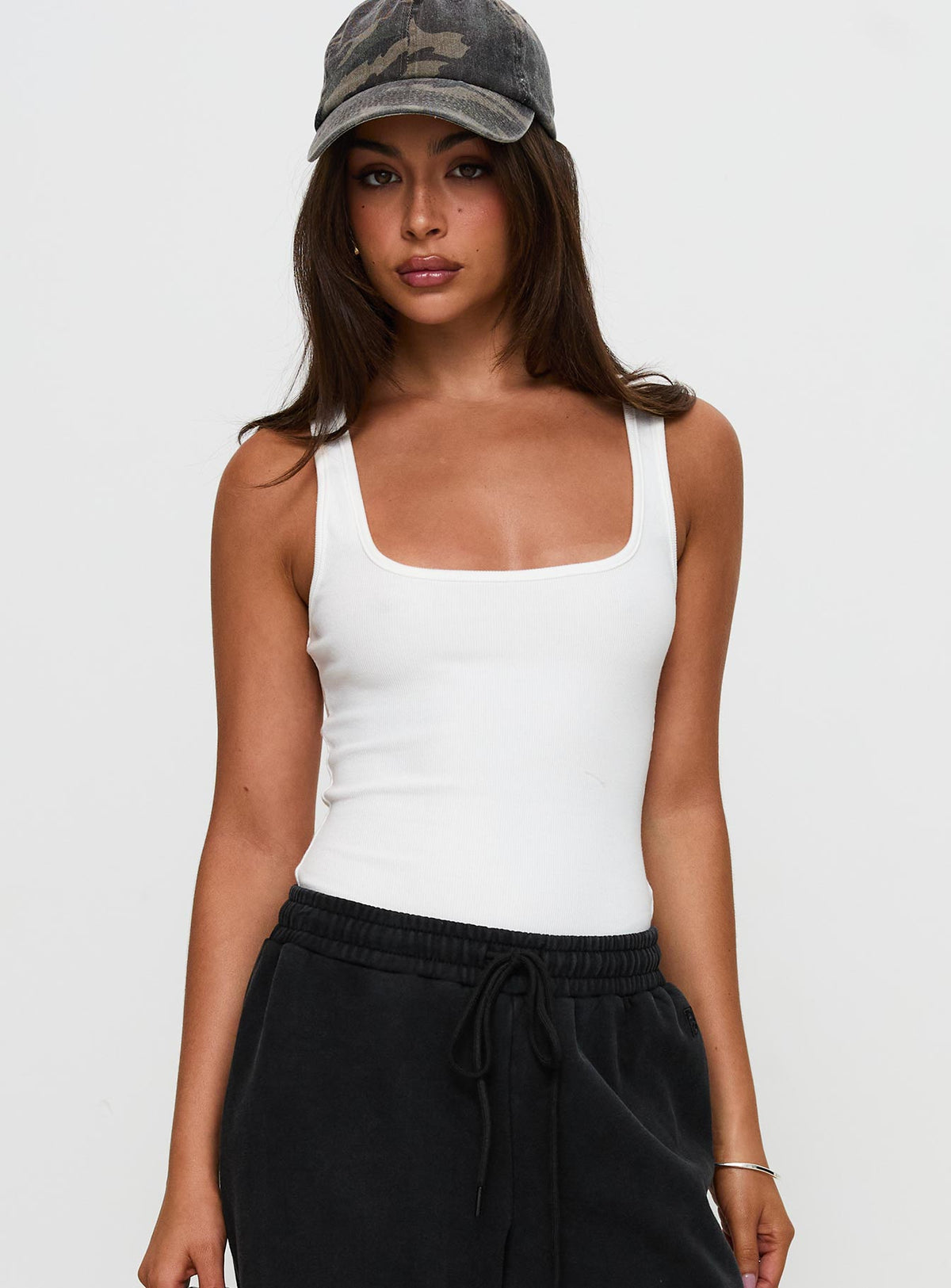 front view of model wearing Princess Polly Baseline Rib Bodysuit White Sleeveless 