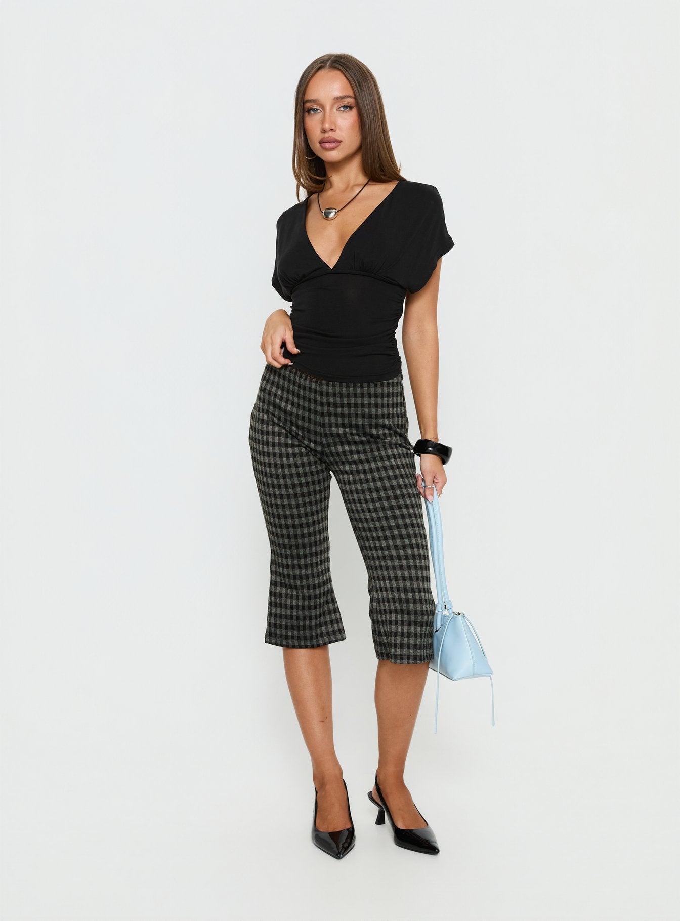 side view of model wearing Princess Polly Lights Are Off Capri Pants Multi Mid Rise Pants 