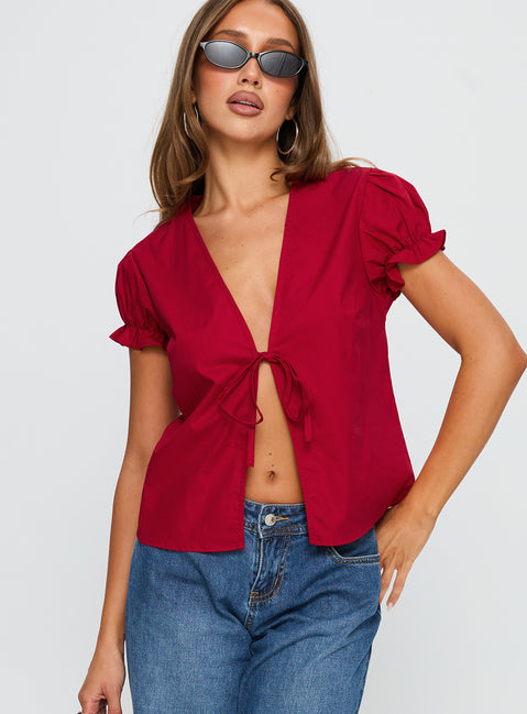 front view of model wearing Princess Polly Starstruck Tie Up Top Red Short Sleeves V-Neck 