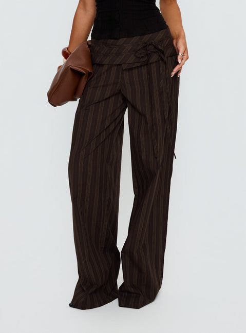 back view of model wearing Princess Polly Seneca Wrap Pant Brown Stripe Mid Rise Pants 