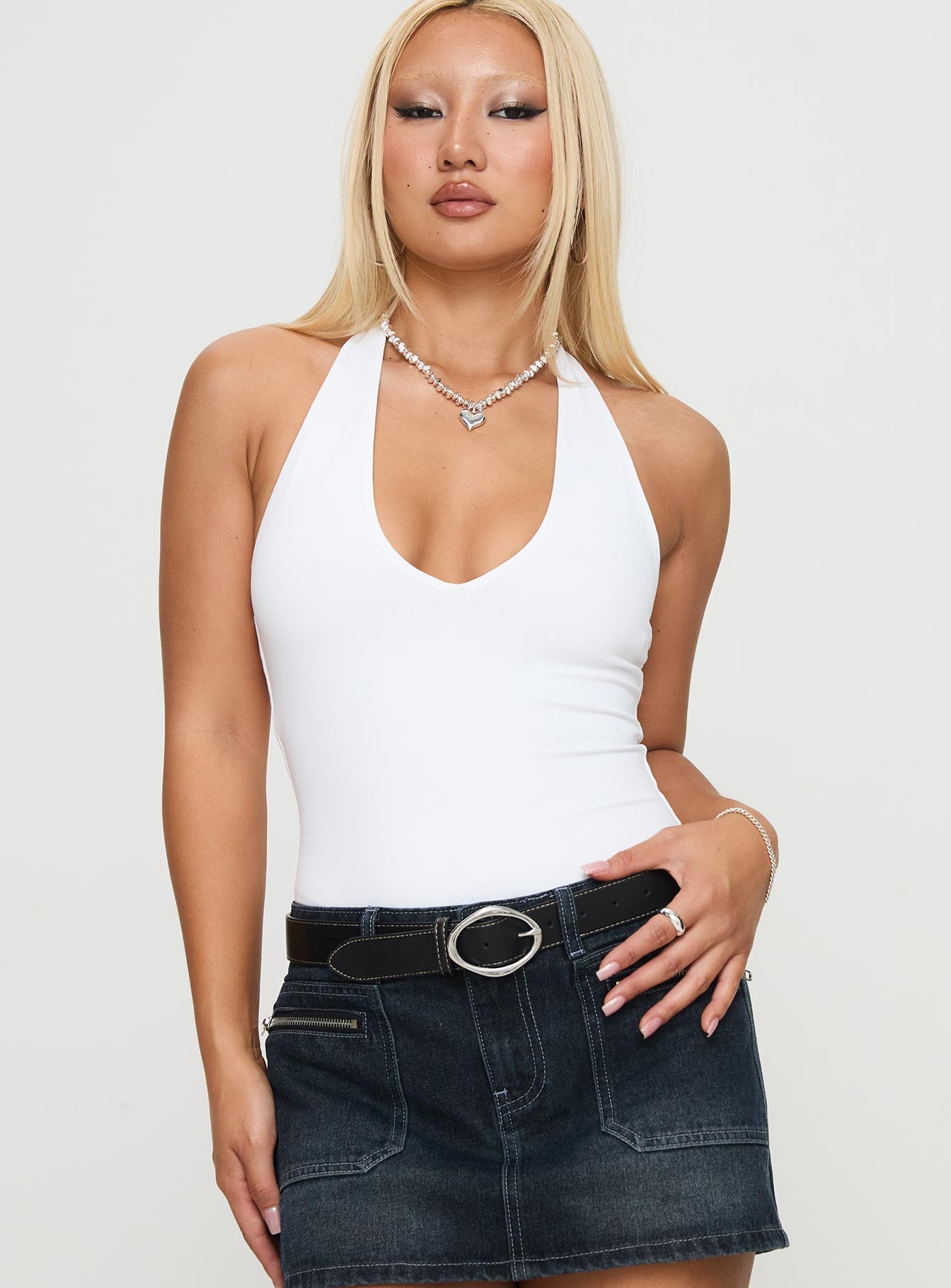 front view of model wearing Princess Polly Someone New Halter Bodysuit White Sleeveless Plunger 