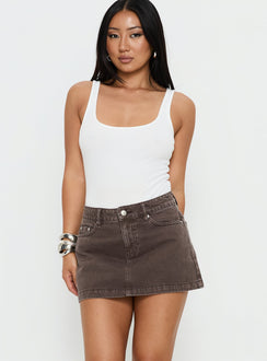   front view of model wearing Princess Polly Nicolina Low Rise Denim Mini Skirt Washed Brown Mini Skirts 
