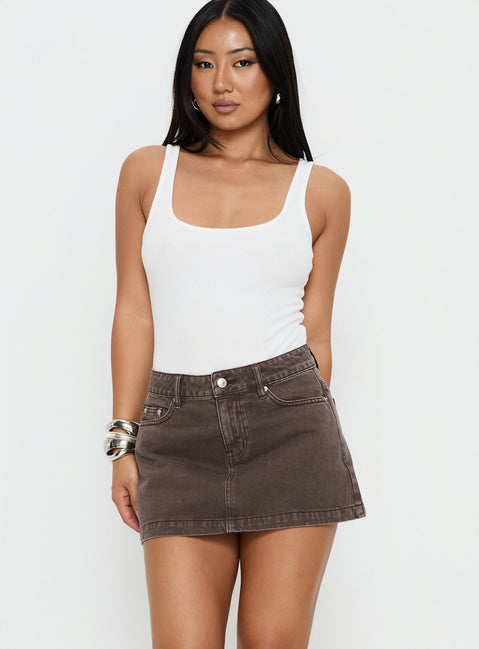   front view of model wearing Princess Polly Nicolina Low Rise Denim Mini Skirt Washed Brown Mini Skirts 
