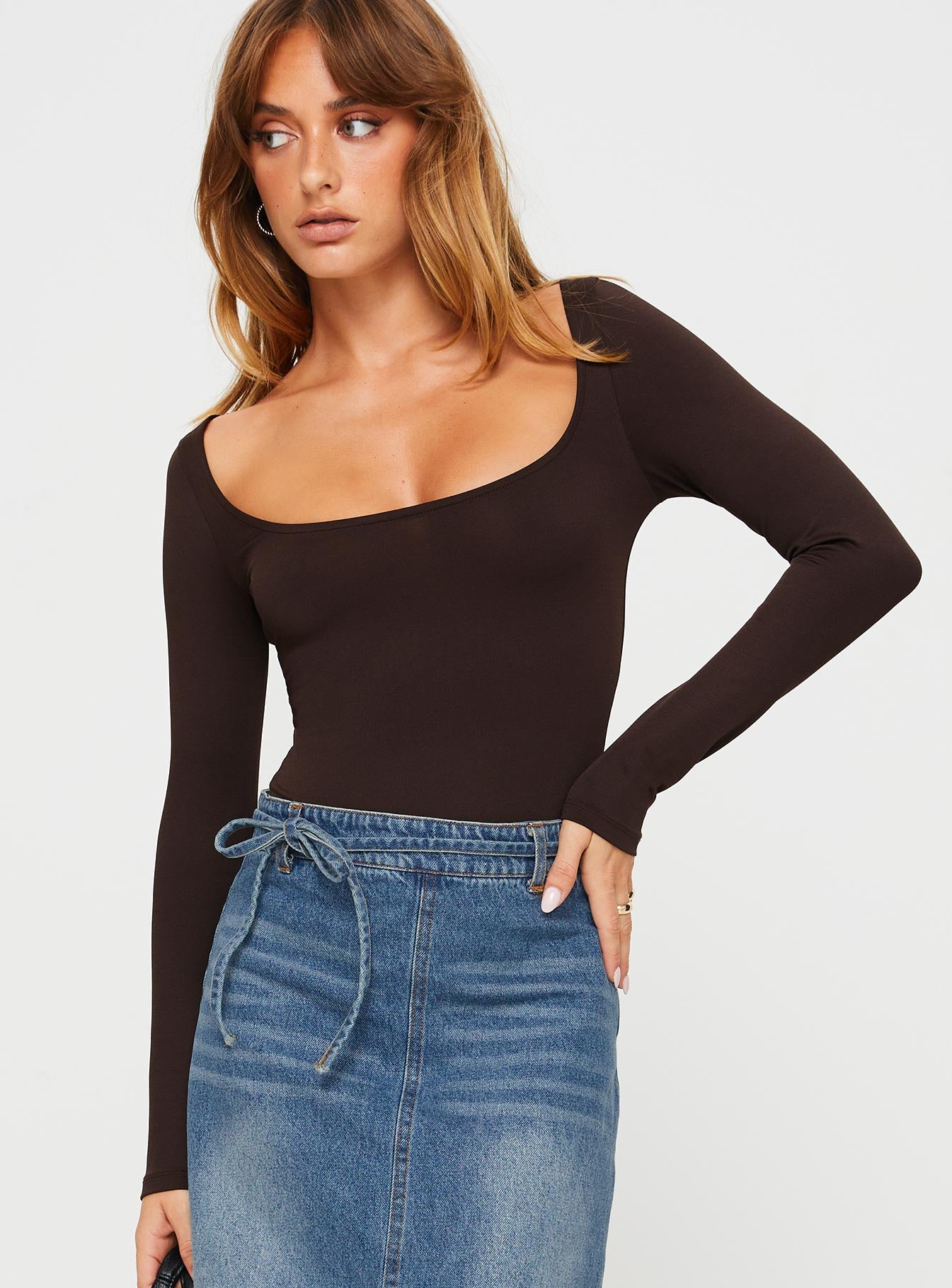 front view of model wearing Princess Polly Ellery Bodysuit Brown Tall Full Sleeves 