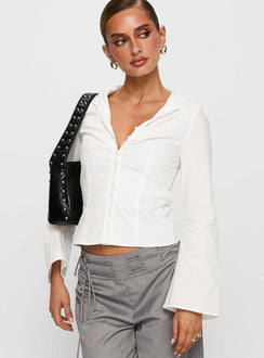 side view of model wearing Princess Polly Arianwyn Long Sleeve Shirt White Full Sleeves V-Neck 