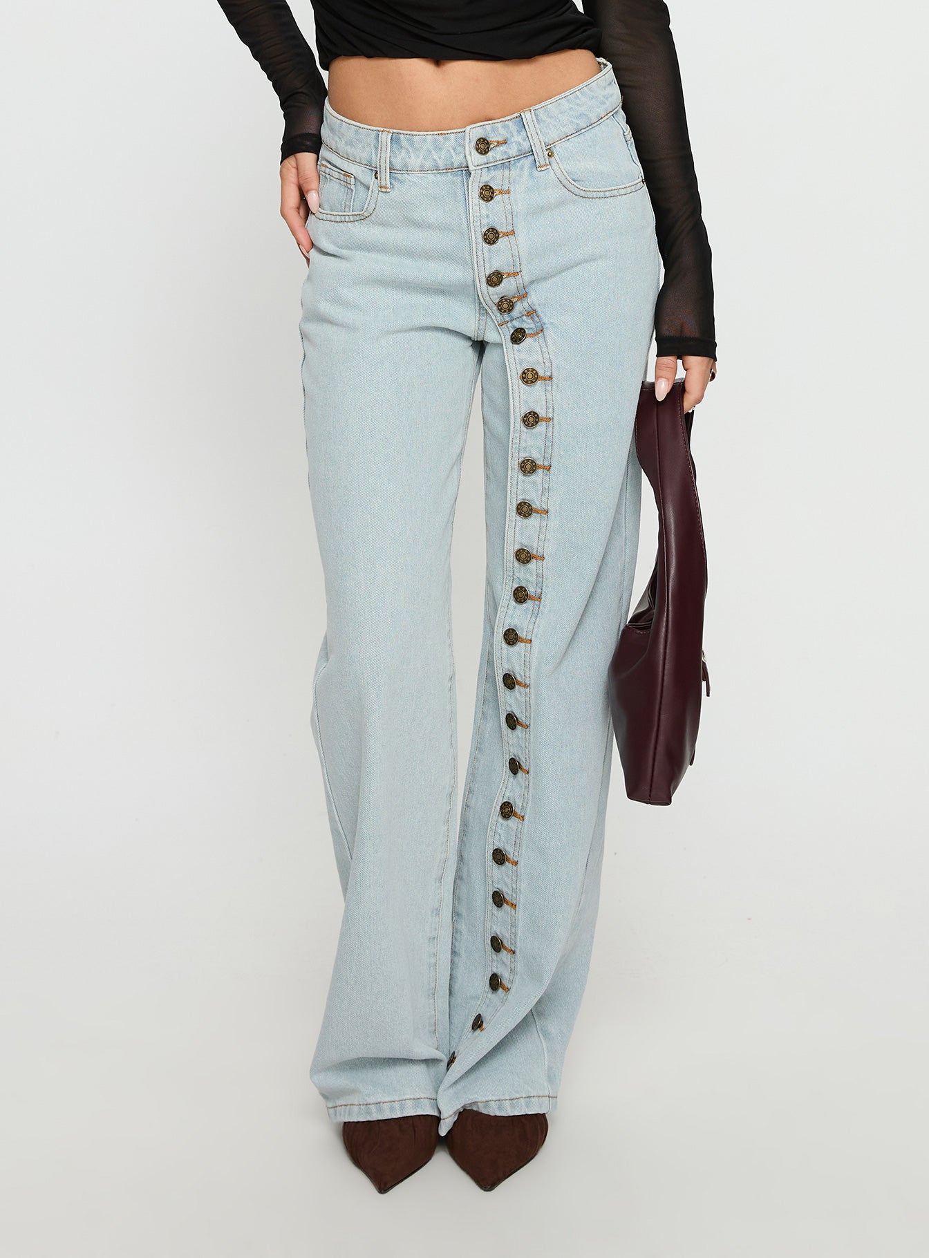 back view of model wearing Princess Polly Penny Mid Rise Straight Leg Jeans Light Denim Low Rise Jeans 