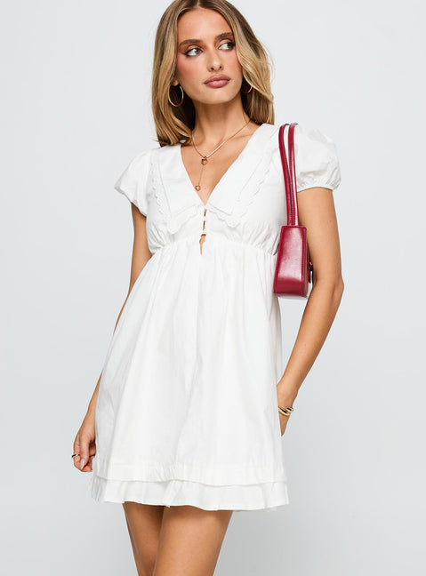side view of model wearing Princess Polly Sailoh Puff Sleeve Baby Doll Mini Dress White V-Neck 