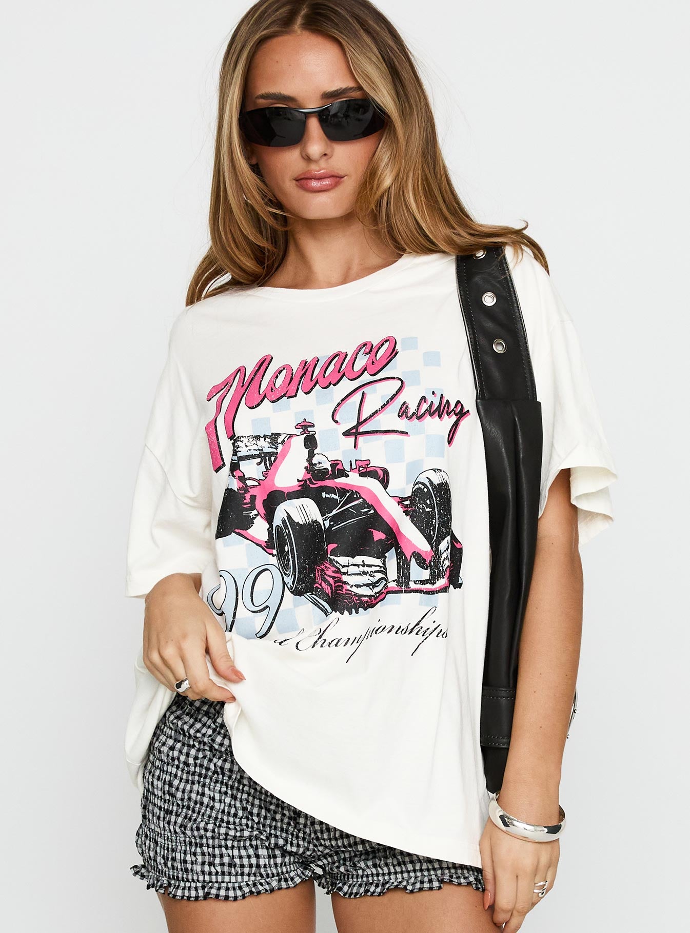 back view of model wearing Princess Polly Monaco Racing 99 Oversized Tee White Half Sleeves Crew Neck 