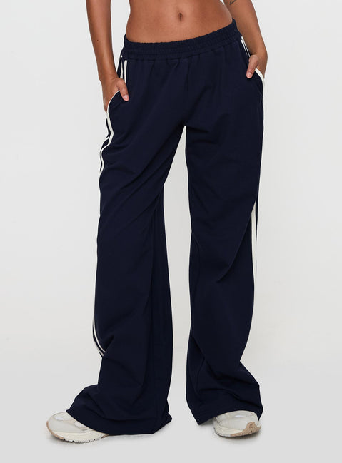 back view of model wearing Princess Polly Circuit Track Pants Navy 