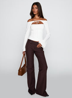 front view of model wearing Princess Polly Kinkirk Flared Pants Brown Pinstripe Low Rise Pants 