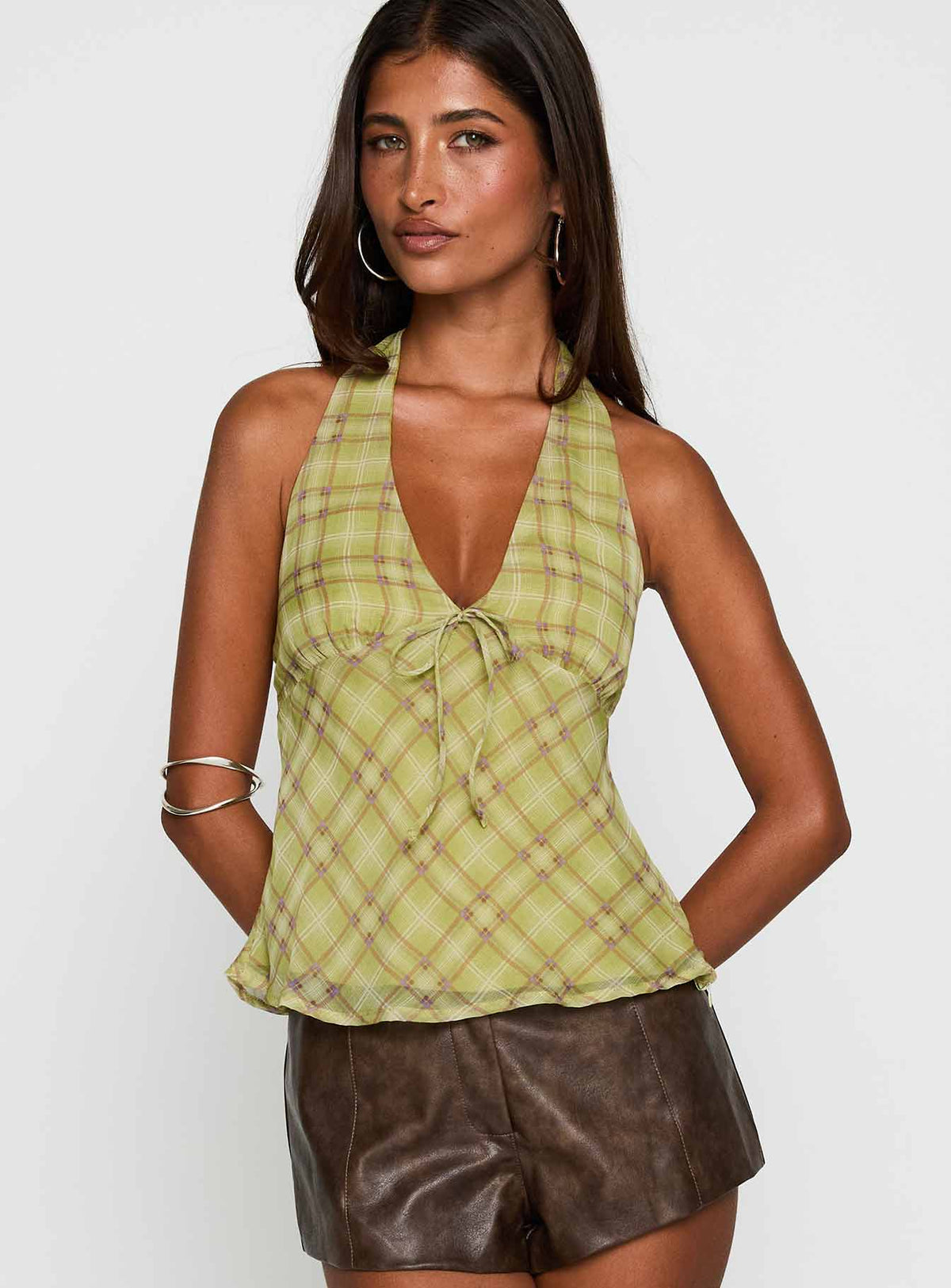 front view of model wearing Princess Polly Amalthea Top Green Check Sleeveless Plunger 