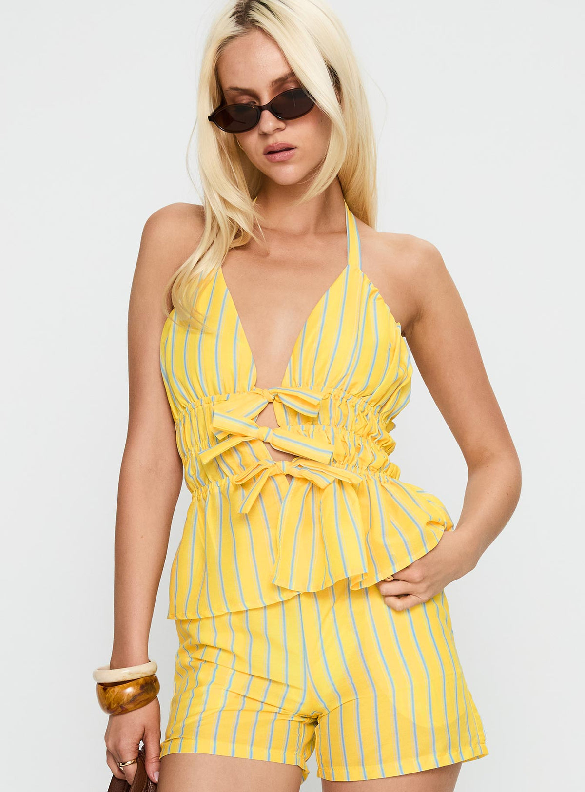 side view of model wearing Princess Polly Delicacy Tie Detail Top Yellow Stripe Sleeveless Plunger 