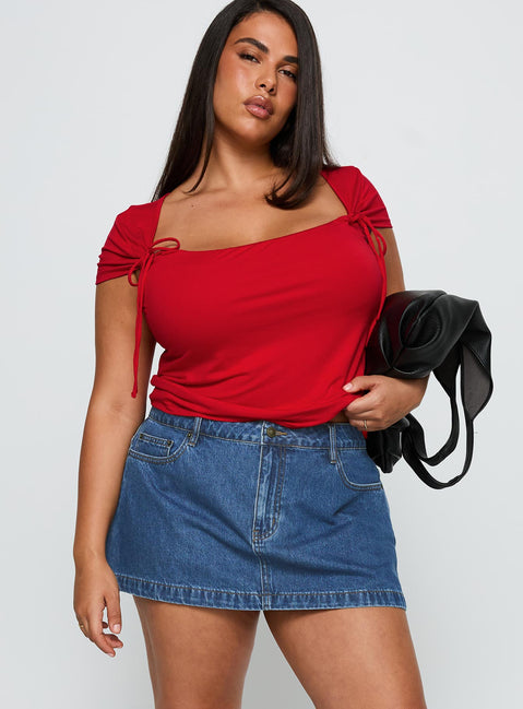   front view of model wearing Princess Polly Nicolina Low Rise Denim Mini Skirt Light Wash Curve Mini Skirts 