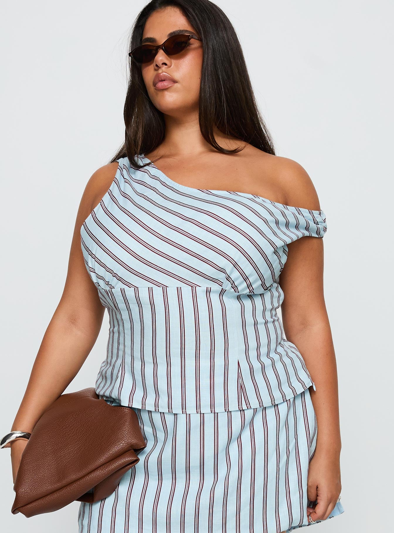 front view of model wearing Princess Polly Del Rio Off The Shoulder Top Blue / Maroon Curve Sleeveless Asymmetric Neckline 