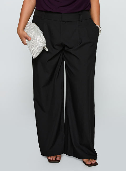 back view of model wearing Princess Polly Two Lovers Low Rise Pants Black Curve Low Rise Pants 