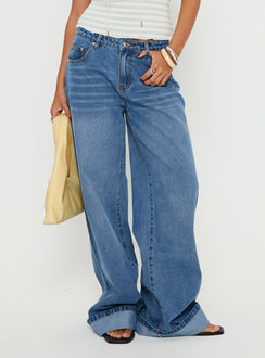 side view of model wearing Princess Polly Jacobie Mid Rise Wide Leg Jeans Mid Blue Wash Mid Rise Jeans 