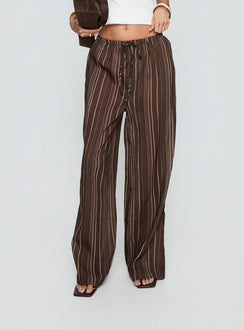 side view of model wearing Princess Polly Parklea Pants Brown Multi High Rise Pants 