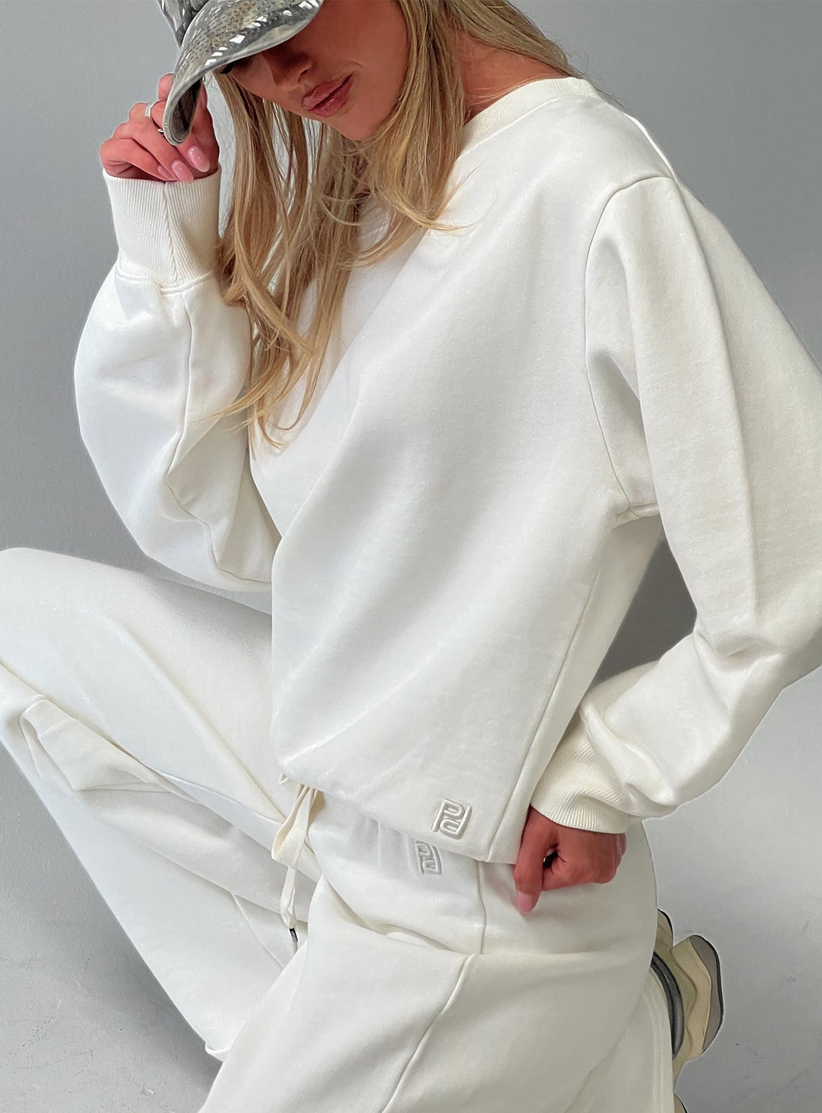 back view of model wearing Princess Polly Wellness Off The Shoulder Jumper Washed White 