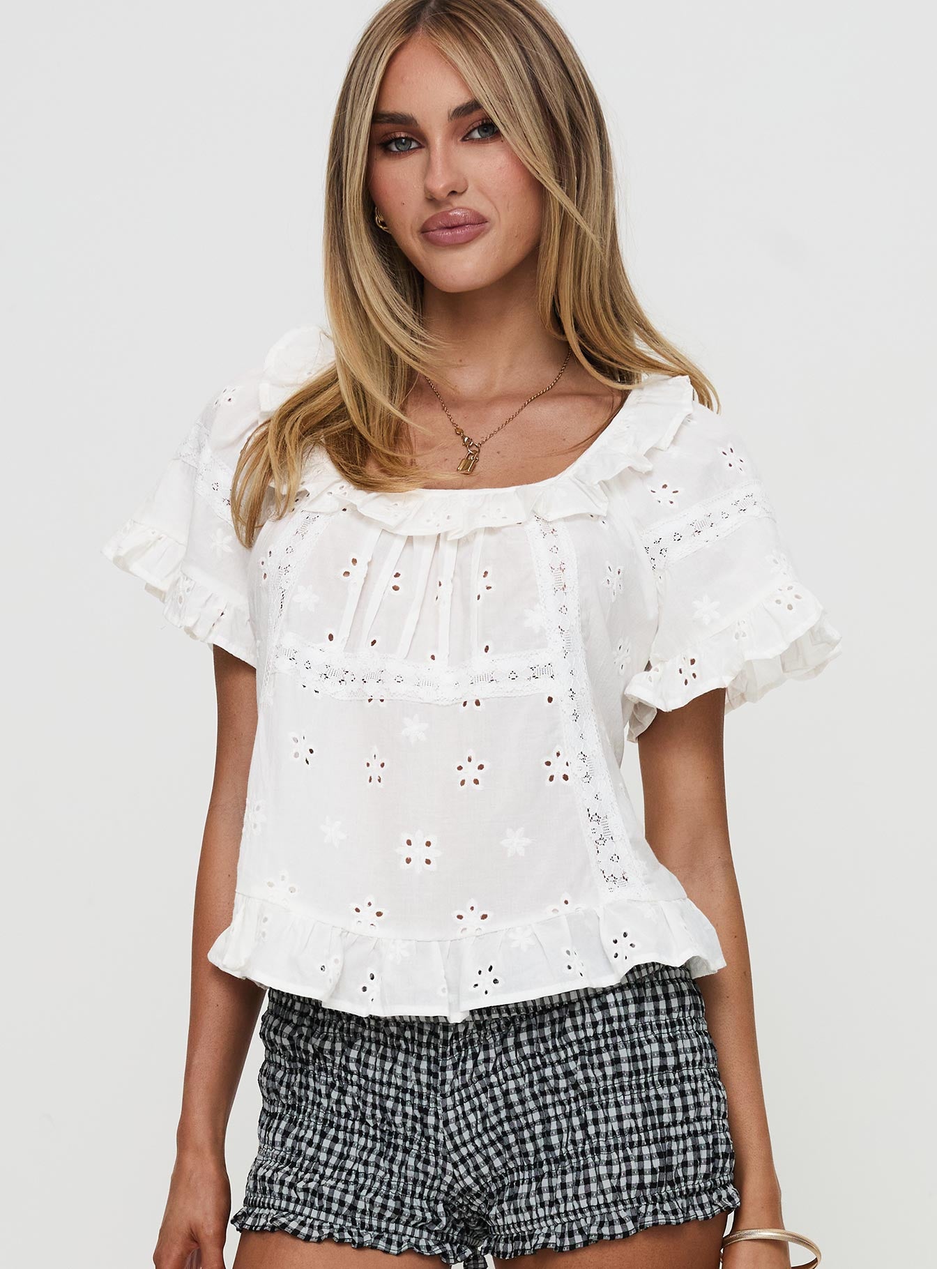 front view of model wearing Princess Polly Teigen Broiderie Top White Short Sleeves Square Neck 