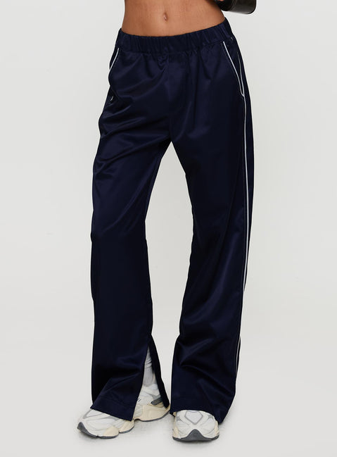 side view of model wearing Princess Polly Travalta Satin Track Pant Navy Low Rise Pants Pants 