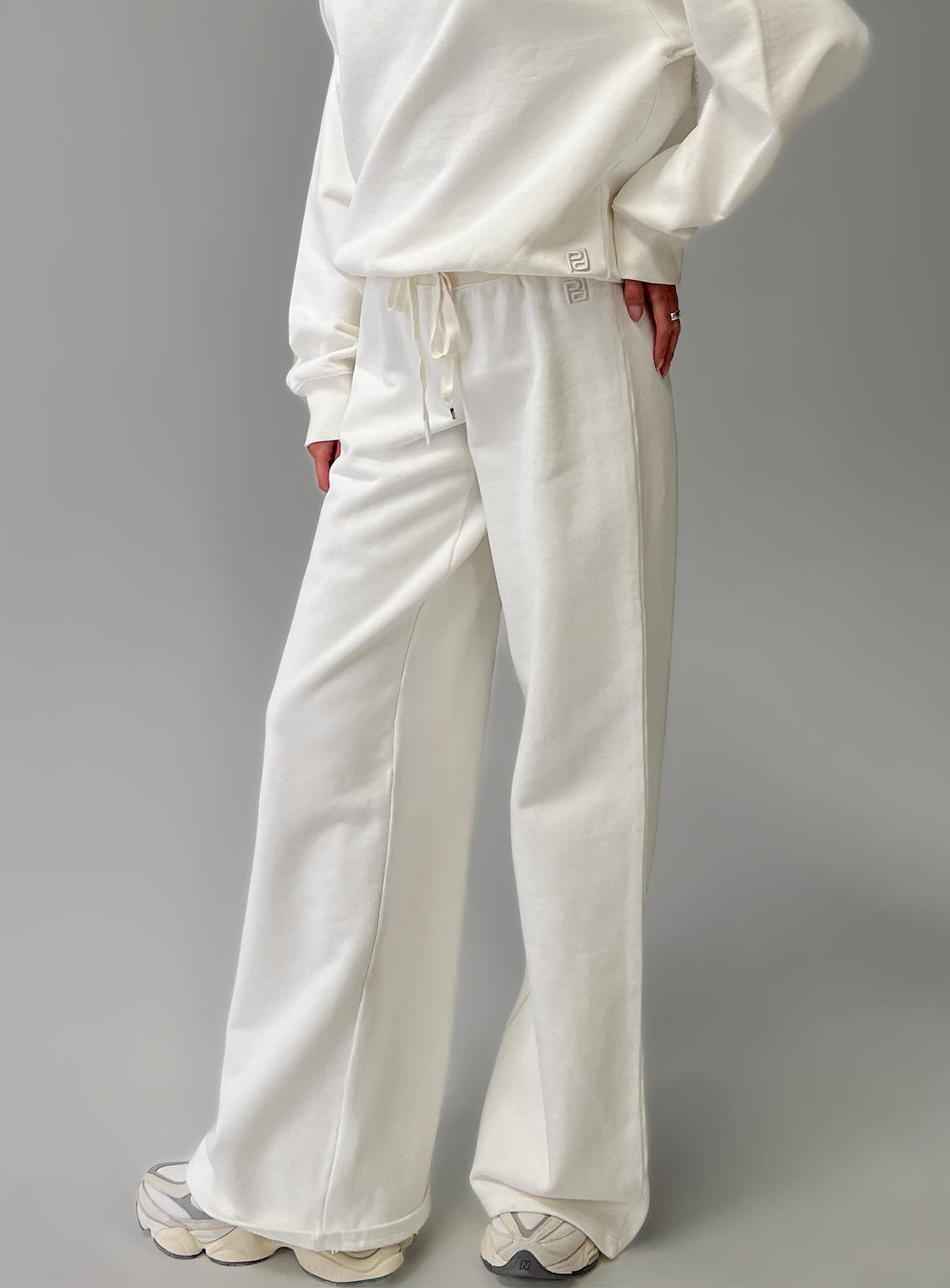back view of model wearing Princess Polly Dodie Wide Leg Pants Washed White High Rise Pants Pants 