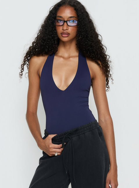 front view of model wearing Princess Polly Someone New Halter Bodysuit Navy Sleeveless Bodysuit 
