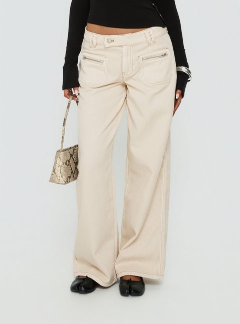 back view of model wearing Princess Polly Lifetimes Mid Rise Wide Leg Cargo Jeans Cream Mid Rise Jeans Jeans 