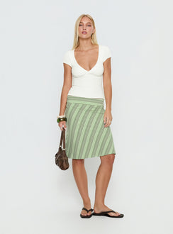   side view of model wearing Princess Polly Lemon Twist Midi Skirt Green Stripe Knee 