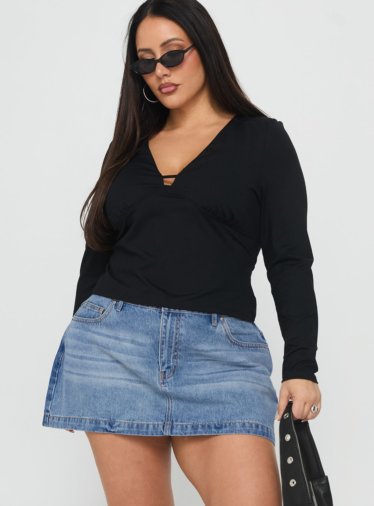   front view of model wearing Princess Polly Fossils Denim Mini Skirt Blue Curve Mini Skirts 