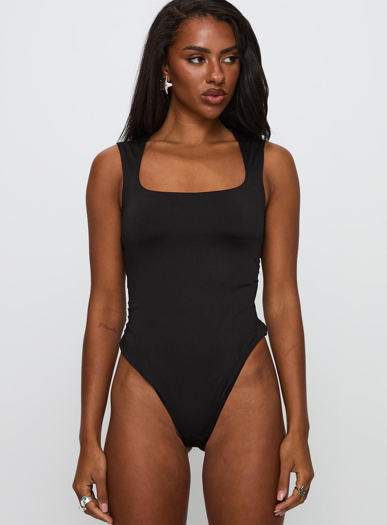 front view of model wearing Princess Polly So Divine Cut Out Bodysuit Black Sleeveless 