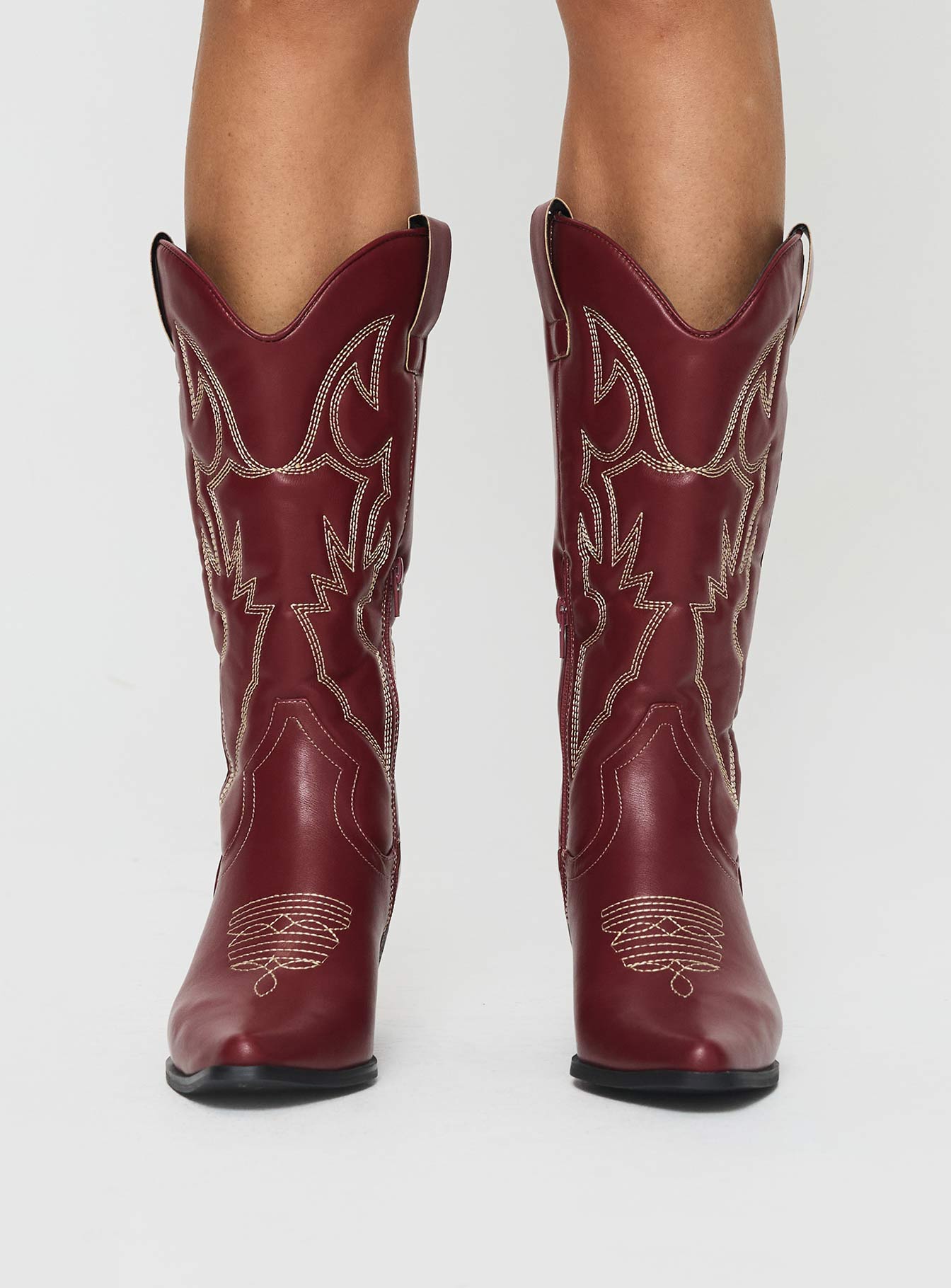 <span>Pointed toe, e</span>mbroidered detailing, cuban heel, zip fastening at side